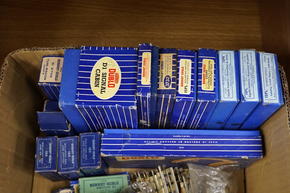 A collection of Hornby Dublo railway for 3-rail running, including three boxed locomotives; an LNER class A4 4-6-2 tender locomotive, Sir Nigel Gresley 7 (EDL1), a BR Duchess of Montrose 46232 (EDL12), and a BR class N2